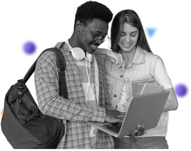 Two students looking at a laptop